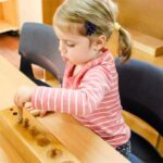 The Cognitive Benefits of Manipulating Knobbed Cylinders in Early Childhood Development